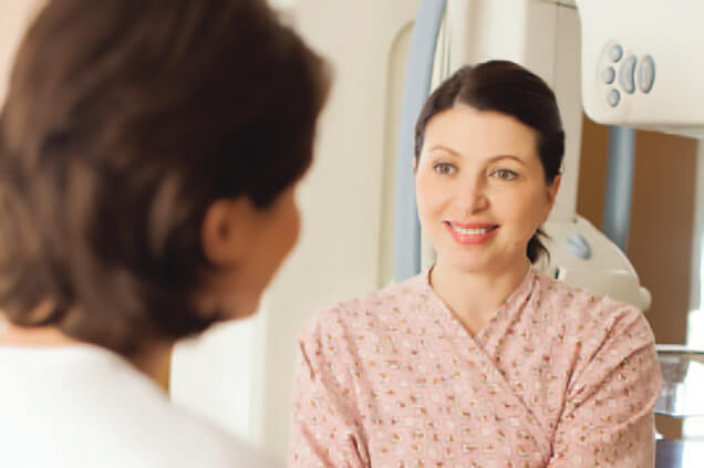 Physician speaking to female patient